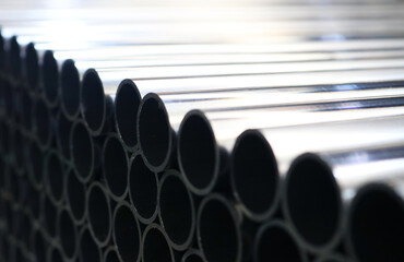 Galvanized steel round pipe in dark light.	