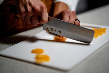 Obraz na płótnie Canvas Preparing Food With Knife
