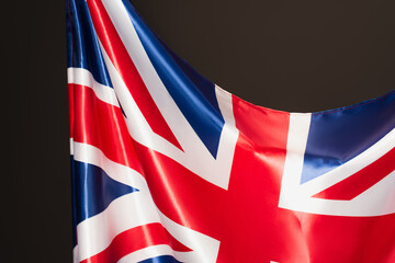 flag of united kingdom with red cross isolated on black