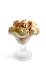 Cream and fruit flavored ice cream in glass cup isolated on white, copy space