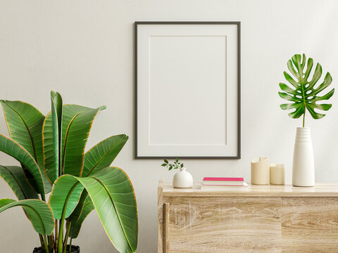 Mockup photo frame on the wooden cabinet with beautiful plants.