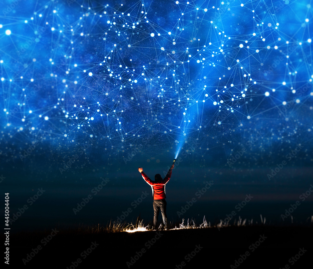 Poster man holding a flashlight and illuminating the night sky graphical network connection. global network