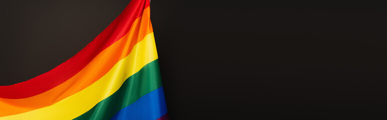 colorful lgbt flag isolated on black, banner