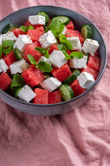Summer salad with watermelon, mint, cucumber and feta cheese close up
