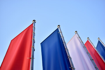 Tricolor flags on the square are red white and blue