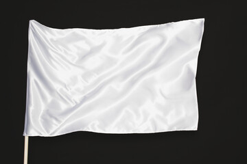 white satin flag isolated on black background
