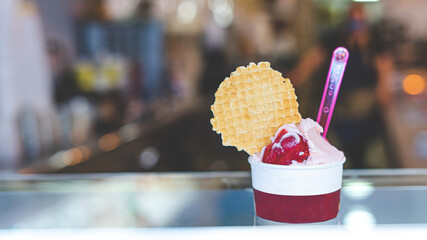 strawberry ice cream tub with corporate background for ice cream parlors