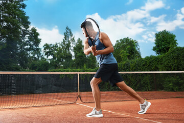 Man playing tennis on court. Racket sport
