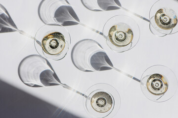 Top view of cocktail glasses with dry martini with on white background.