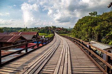 Fototapeta na wymiar Mon Bridge, old wooden bridge at sunset in Sangkhlaburi, Kanchanaburi, Thailand