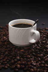 Coffee mug isolated on coffee background front view