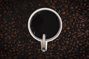 Coffee mug isolated on coffee background front view
