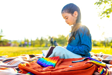 preteen latin kid schoolgirl student wears uniform and backpack outdoors
