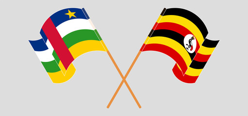 Crossed and waving flags of Central African Republic and Uganda