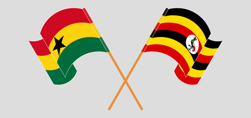 Crossed and waving flags of Ghana and Uganda