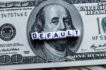 One hundred US dollars banknotes. Default word in cubes. Bankruptcy. Cash one hundred dollar bills,...
