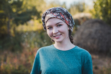 A beautiful caucasian girl with a headscarf - obrazy, fototapety, plakaty
