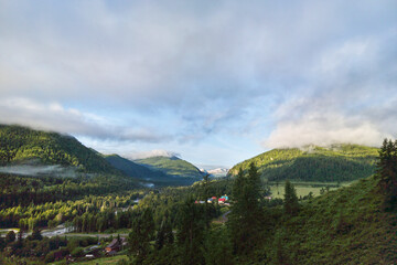Fototapeta premium Vacation landscape. Russian Altai mountains. Multa region. Holiday at home. Staycation concept. Long distanse road. Reduce carbon footprint. Sustainable lifestyle. Holiday trail. Local travel