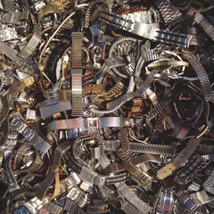 Overhead shot of watch metal straps at the flea market