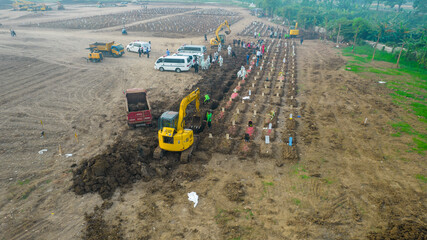 Aerial view of Funeral procession at Rorotan, North Jakarta. Special graves infected with the...