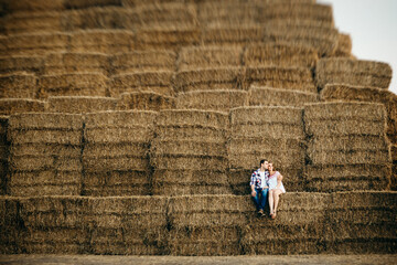 a guy with a girl on a summer walk in the field