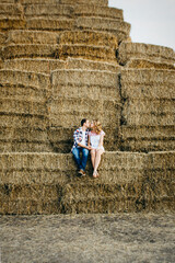 a guy with a girl on a summer walk in the field