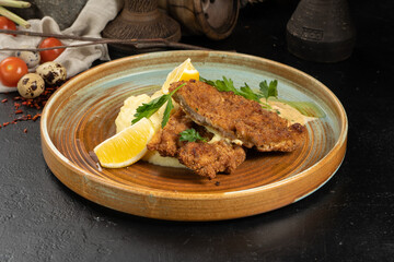 Pork chop with mashed potatoes lemon and gravy