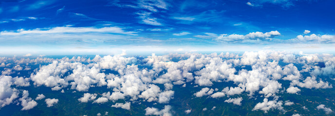 sky panorama.Clear blue sky and white clouds, cloud panorama from above, view from the plane.