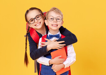 Cheerful schoolkids in glasses having fun