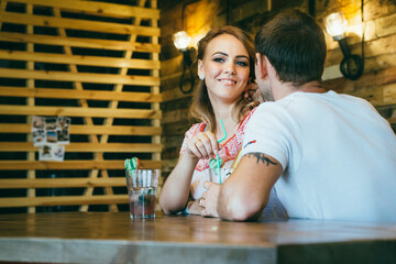 guy and a girl meeting in a city cafe