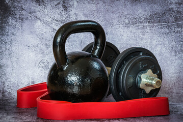 Fototapeta premium dummbells and kettlebell on vintage background