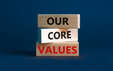 Our core values symbol. Concept words 'Our core values' on wooden blocks on a beautiful grey...