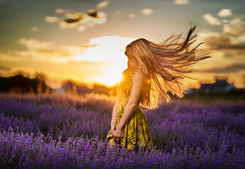 Young woman in blooming lavender field