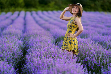 Young woman in blooming lavender field