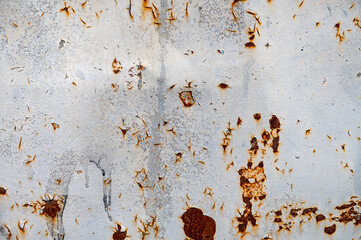 Rusty metal texture. Peeling paint on the rust wall.