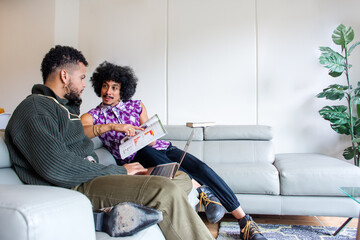 Two black men spending time together at home