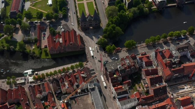 High angle view of old town with red brick buildings. Orbiting around Holsten Gate. Luebeck, Schleswig-Holstein, Germany