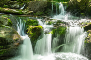 Long exposure of a waterfall on the Hoar Oak Water river at Watersmeet in Exmoor National Park