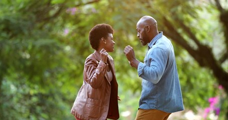 Happy African couple dancing celebrating outside in street. two people dance - Powered by Adobe