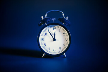 Analog clock on blue background