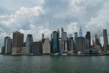 Fototapeta premium A view of Manhattan skyline from Brooklyn bridge park in New York City, USA