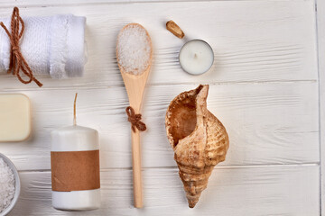 Top view spa beauty stuff on white wooden desk.