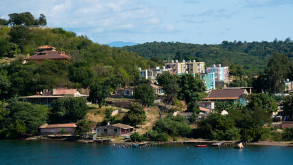 Fototapeta na wymiar Colorful buildings and villas on the coast line of Santiago de Cuba, Cuba