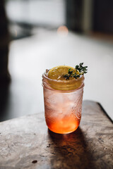 strawberry thyme lemon cocktail drink in mason jam jar summertime