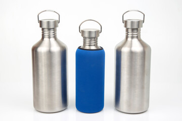 Steel flasks for water and drinks on a white background. Survival hiking gear