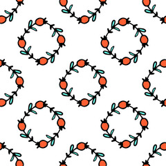 vector seamless pattern of a rhombus of red berries and turquoise leaves.a pattern of geometrically arranged round wreaths of hand-drawn branches in the style of doodles with red berries and green lea