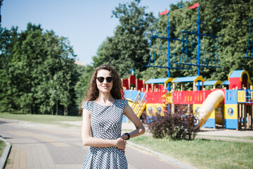 A beautiful Russian girl walks in the city park