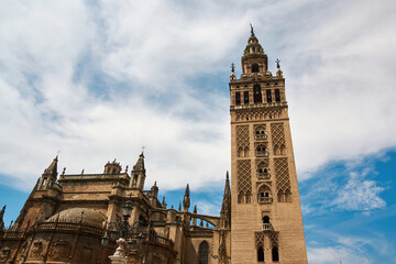 Fototapeta na wymiar Giralda is the name given to the bell tower of the Cathedral of Santa María de la Sede. In its upper part there is a ball called a jar on which the Giraldillo is located.