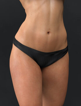 Abdominal press, flat belly. Woman body beauty healthcare. Close up of female body in black panties.