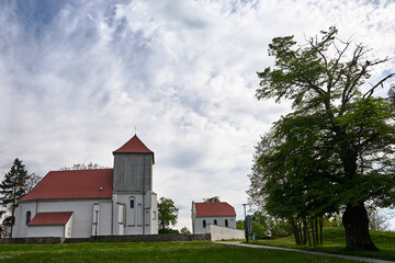 Fototapeta na wymiar A rural Catholic church with a wooden belfry